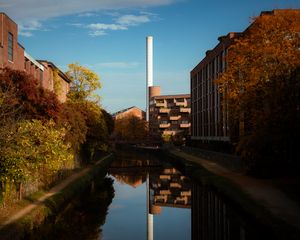 Preview wallpaper buildings, river, pipe, sky, trees, reflection