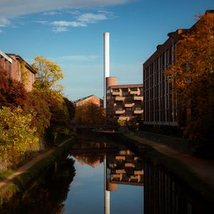 Preview wallpaper buildings, river, pipe, sky, trees, reflection