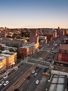 Preview wallpaper buildings, roads, cars, city, sunrise