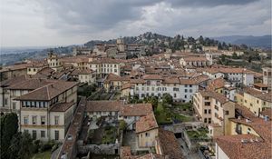 Preview wallpaper buildings, roofs, city, architecture, clouds