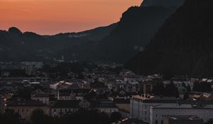 Preview wallpaper buildings, roofs, city, hill, sunset