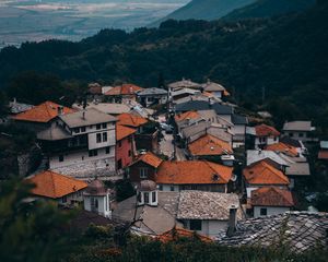 Preview wallpaper buildings, roofs, forest, grass, hills