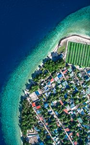 Preview wallpaper buildings, roofs, island, aerial view, coast