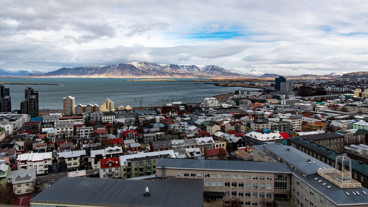 Wallpaper buildings, sea, mountains, clouds, city