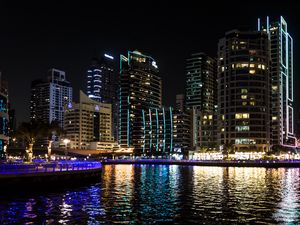 Preview wallpaper buildings, sea, ripples, lights, night, dark, city