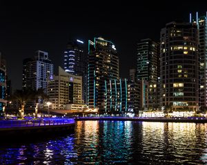 Preview wallpaper buildings, sea, ripples, lights, night, dark, city