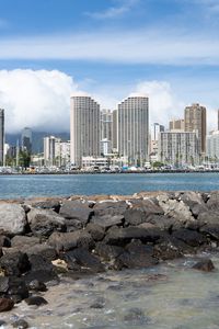 Preview wallpaper buildings, sea, water, stones, city