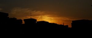 Preview wallpaper buildings, silhouette, sunset, clouds