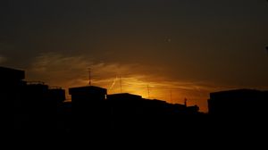 Preview wallpaper buildings, silhouette, sunset, clouds