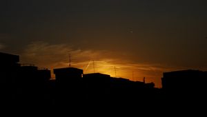 Preview wallpaper buildings, silhouette, sunset, clouds