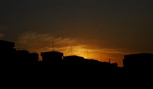 Preview wallpaper buildings, silhouette, sunset, clouds