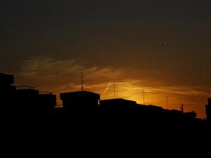 Preview wallpaper buildings, silhouette, sunset, clouds