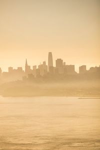 Preview wallpaper buildings, silhouettes, fog, city, coast