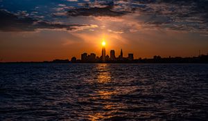 Preview wallpaper buildings, silhouettes, sea, sun, sunset, dark