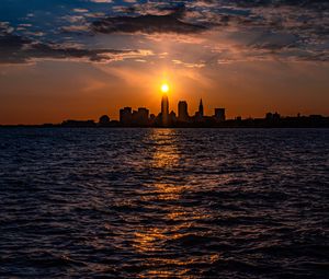 Preview wallpaper buildings, silhouettes, sea, sun, sunset, dark