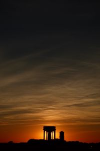 Preview wallpaper buildings, silhouettes, sky, evening, sunset