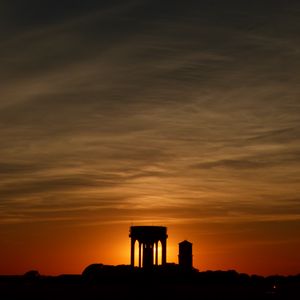 Preview wallpaper buildings, silhouettes, sky, evening, sunset