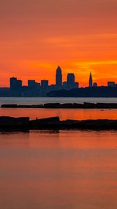 Preview wallpaper buildings, silhouettes, water, sunset, horizon, dark