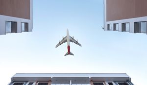 Preview wallpaper buildings, sky, plane, bottom view, architecture