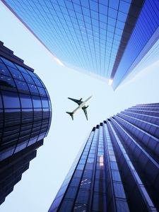 Preview wallpaper buildings, sky, plane, skyscrapers, architecture