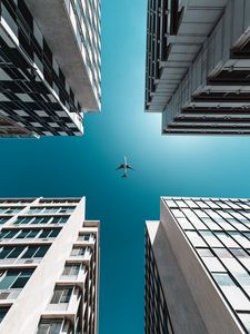 Preview wallpaper buildings, sky, plane, bottom view