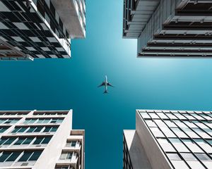 Preview wallpaper buildings, sky, plane, bottom view