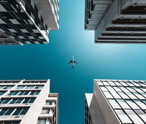 Preview wallpaper buildings, sky, plane, bottom view