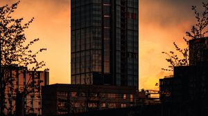 Preview wallpaper buildings, skyscraper, sunset, dark