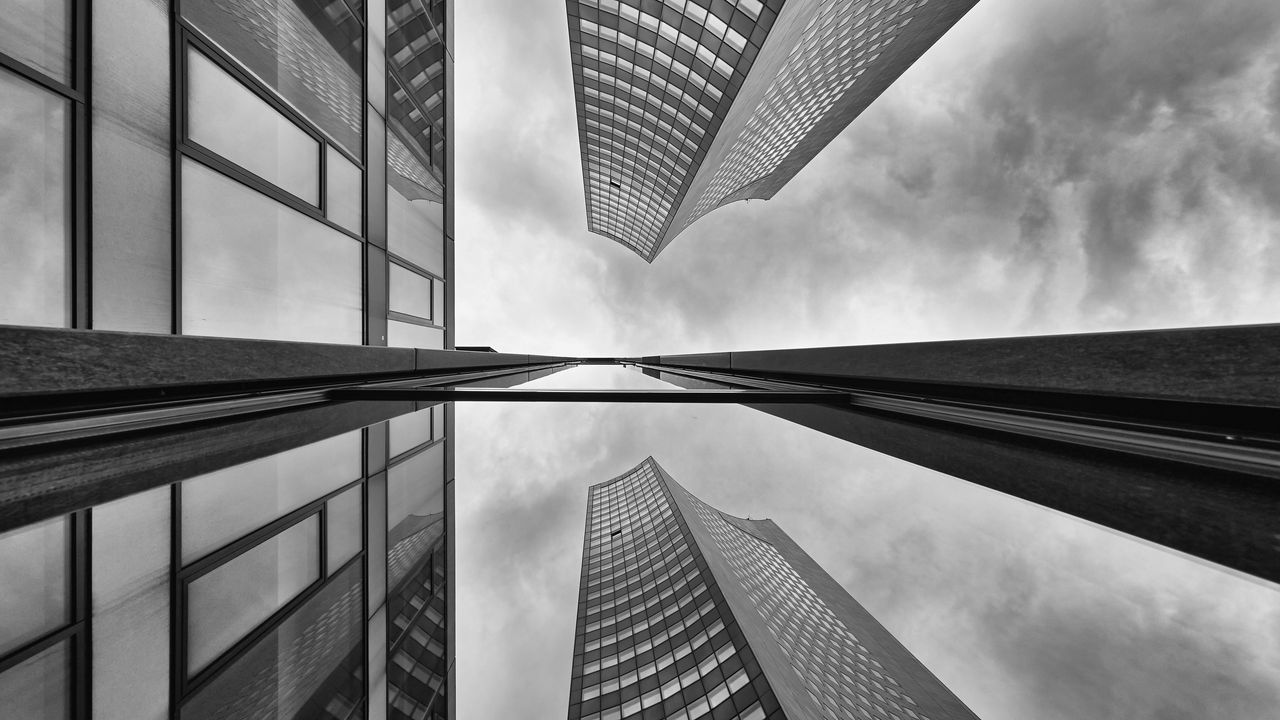 Wallpaper buildings, skyscrapers, bottom view, black and white, reflection