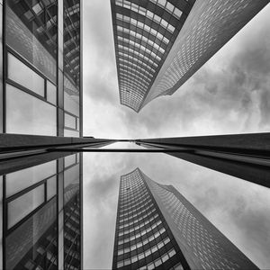 Preview wallpaper buildings, skyscrapers, bottom view, black and white, reflection