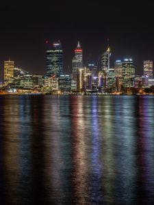 Preview wallpaper buildings, skyscrapers, city, lights, dark, night, sea