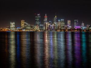 Preview wallpaper buildings, skyscrapers, city, lights, dark, night, sea