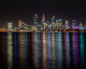 Preview wallpaper buildings, skyscrapers, city, lights, dark, night, sea