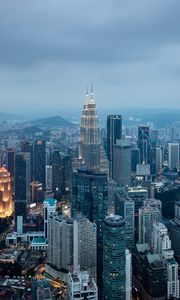 Preview wallpaper buildings, skyscrapers, city, evening, kuala lumpur, malaysia