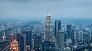 Preview wallpaper buildings, skyscrapers, city, evening, kuala lumpur, malaysia