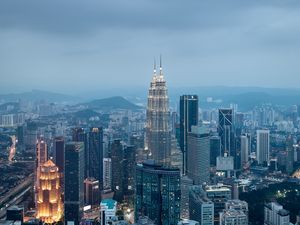 Preview wallpaper buildings, skyscrapers, city, evening, kuala lumpur, malaysia