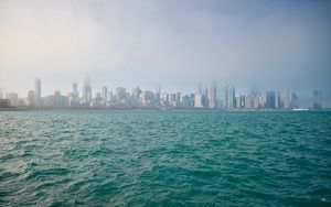 Preview wallpaper buildings, skyscrapers, fog, sea, city