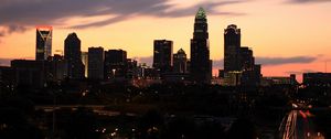 Preview wallpaper buildings, skyscrapers, lights, twilight, city