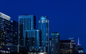 Preview wallpaper buildings, skyscrapers, lights, city, night, blue