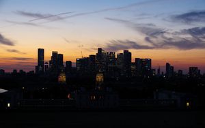Preview wallpaper buildings, skyscrapers, lights, city, twilight