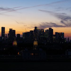 Preview wallpaper buildings, skyscrapers, lights, city, twilight