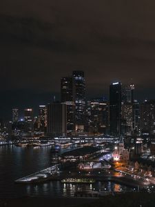 Preview wallpaper buildings, skyscrapers, lights, river, night