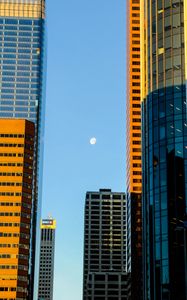 Preview wallpaper buildings, skyscrapers, moon, city, architecture