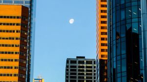 Preview wallpaper buildings, skyscrapers, moon, city, architecture