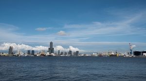 Preview wallpaper buildings, skyscrapers, sea, clouds, city