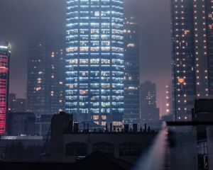 Preview wallpaper buildings, smog, fog, skyscrapers, night city