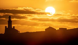 Preview wallpaper buildings, sun, clouds, dark