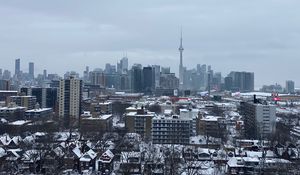 Preview wallpaper buildings, tower, snow, trees, winter, city