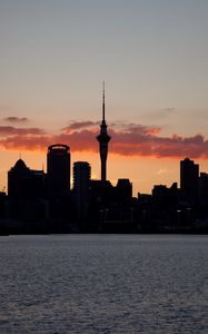 Preview wallpaper buildings, towers, silhouettes, sea, city, twilight