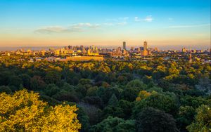Preview wallpaper buildings, trees, city, sunset